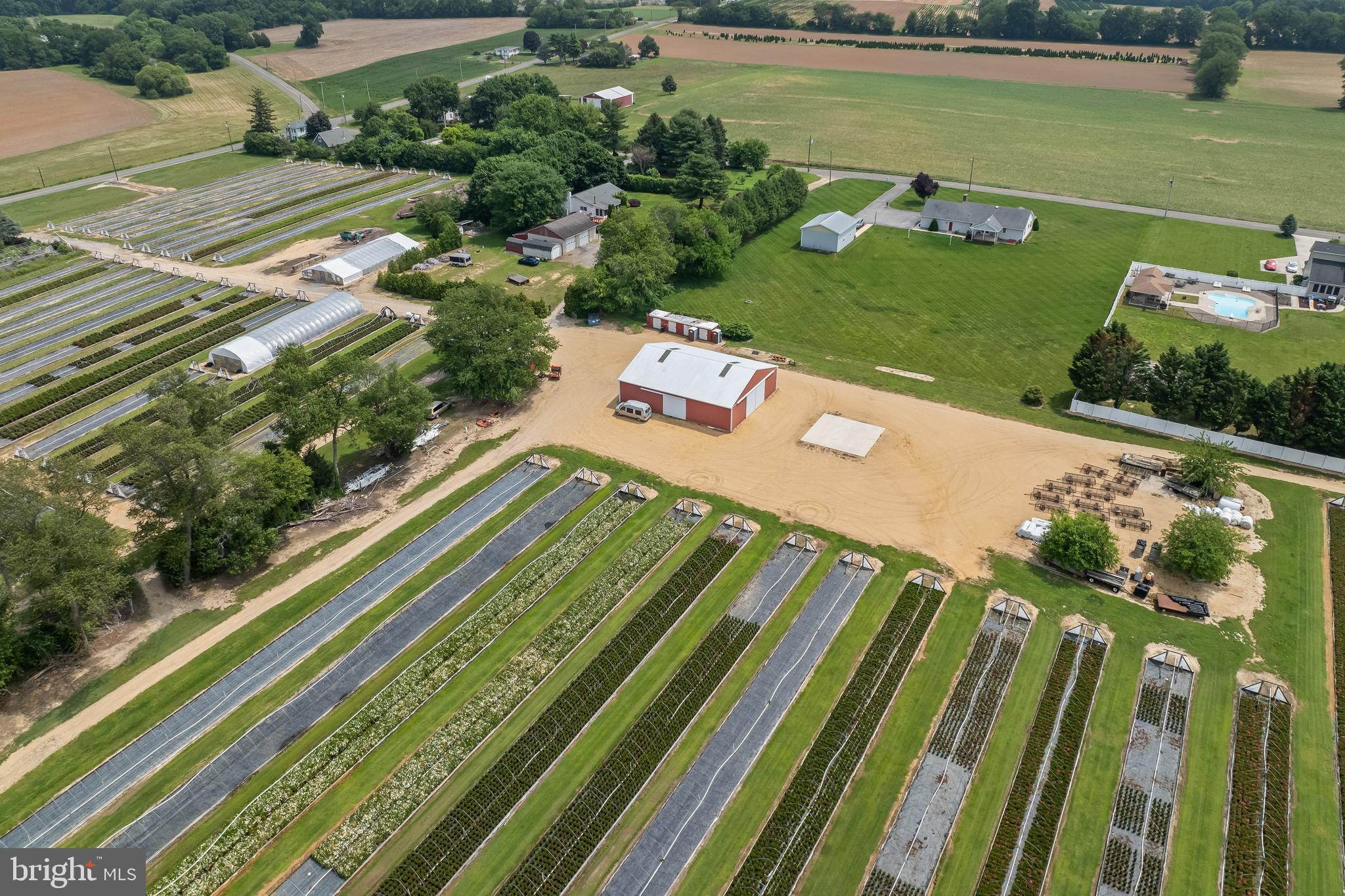 360 Harmony Road Bridgeton, NJ 08302 - Photo 14 of 23 a view of swimming pool with a garden and seating area
