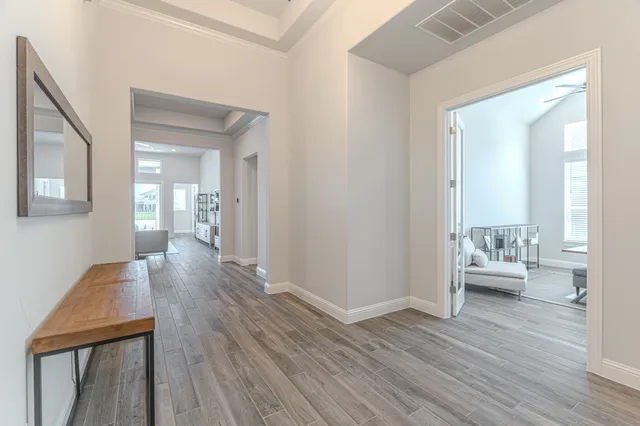 a room with wooden floor and furniture