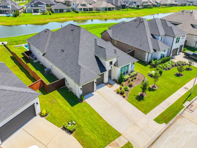 a aerial view of a house with a swimming pool