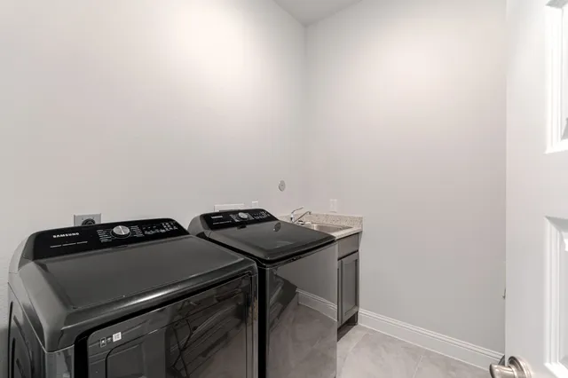 a view of storage and utility room with washer and dryer
