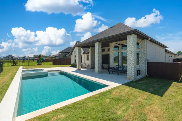 a view of a house with swimming pool