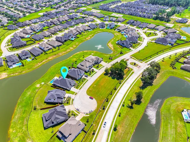 a view of an swimming pool with a garden