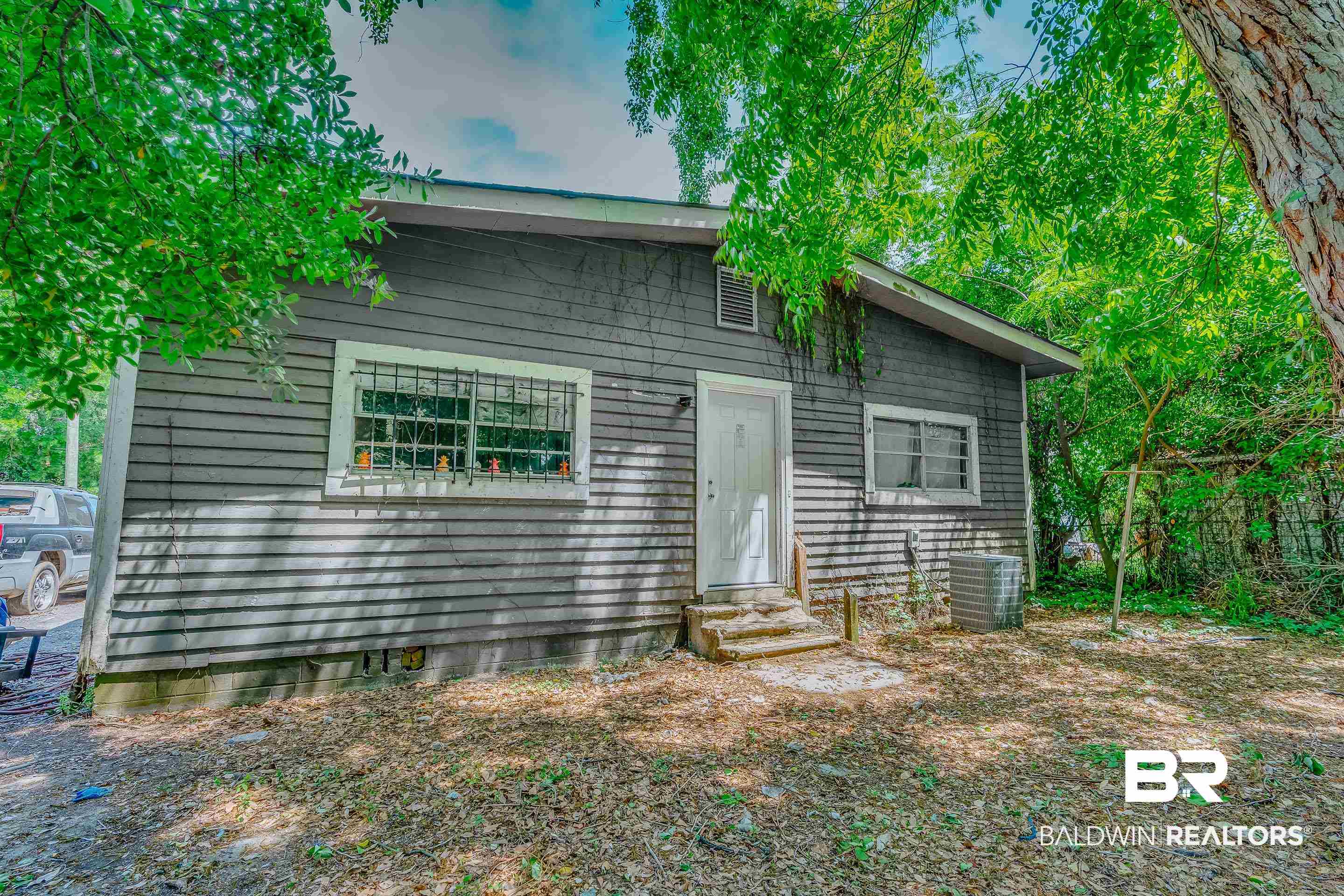 1156 Freeman Street Mobile, AL 36605 - Photo 20 of 22 View of front facade featuring central AC unit and entry steps