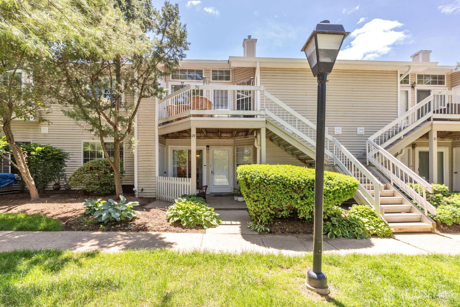 29 Tansy Court Bedminster, NJ 07921 - Photo 1 of 11 a front view of a house with a yard
