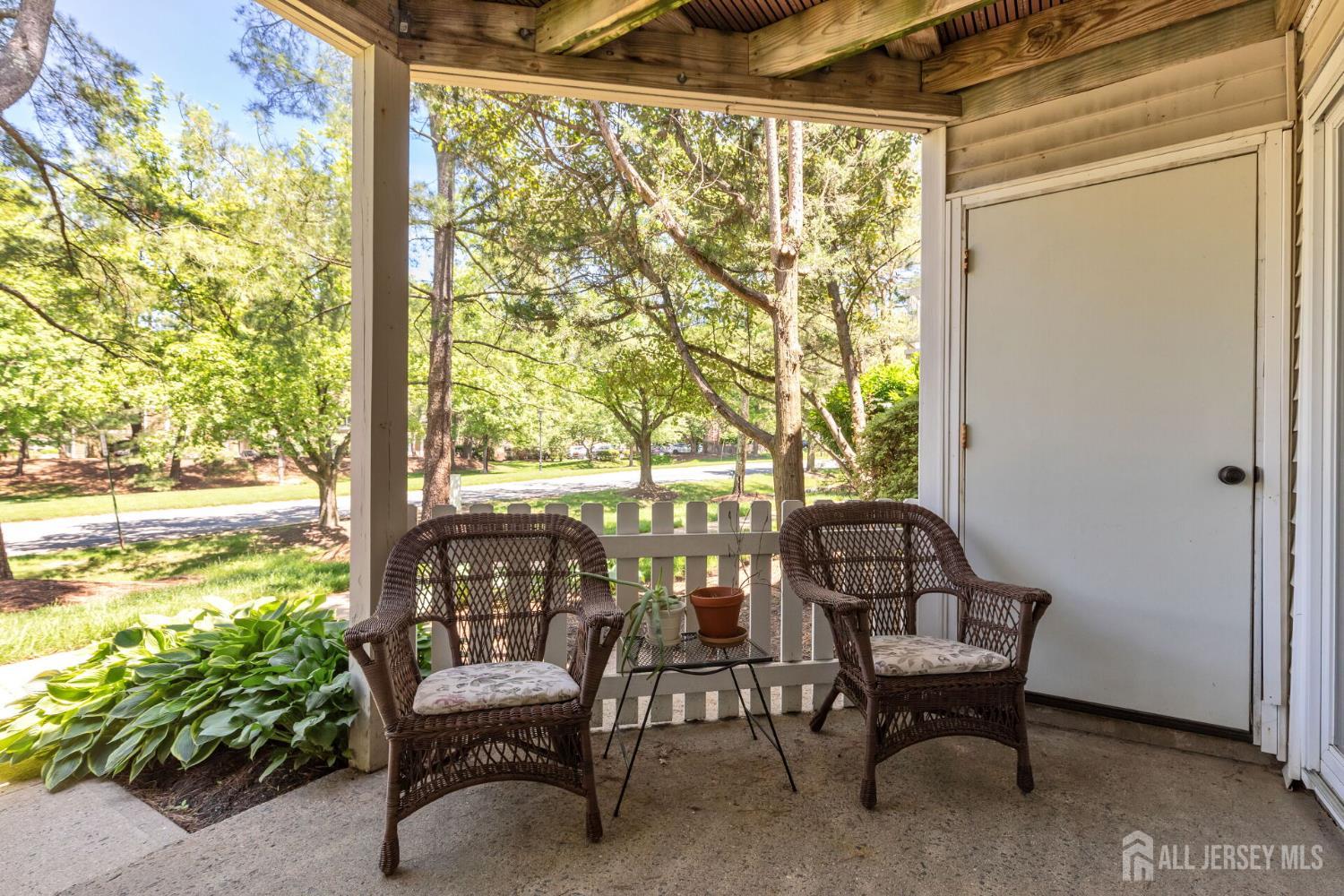 29 Tansy Court Bedminster, NJ 07921 - Photo 10 of 11 a view of a porch with chairs and backyard