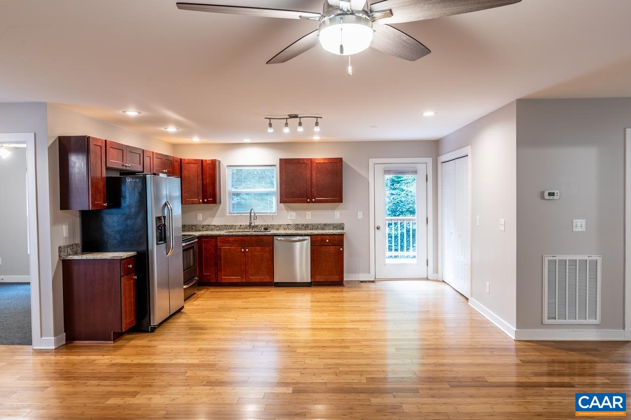 45 East Point Road Palmyra, VA 22963 - Photo 22 of 55 a large kitchen with stainless steel appliances wooden floor and a refrigerator
