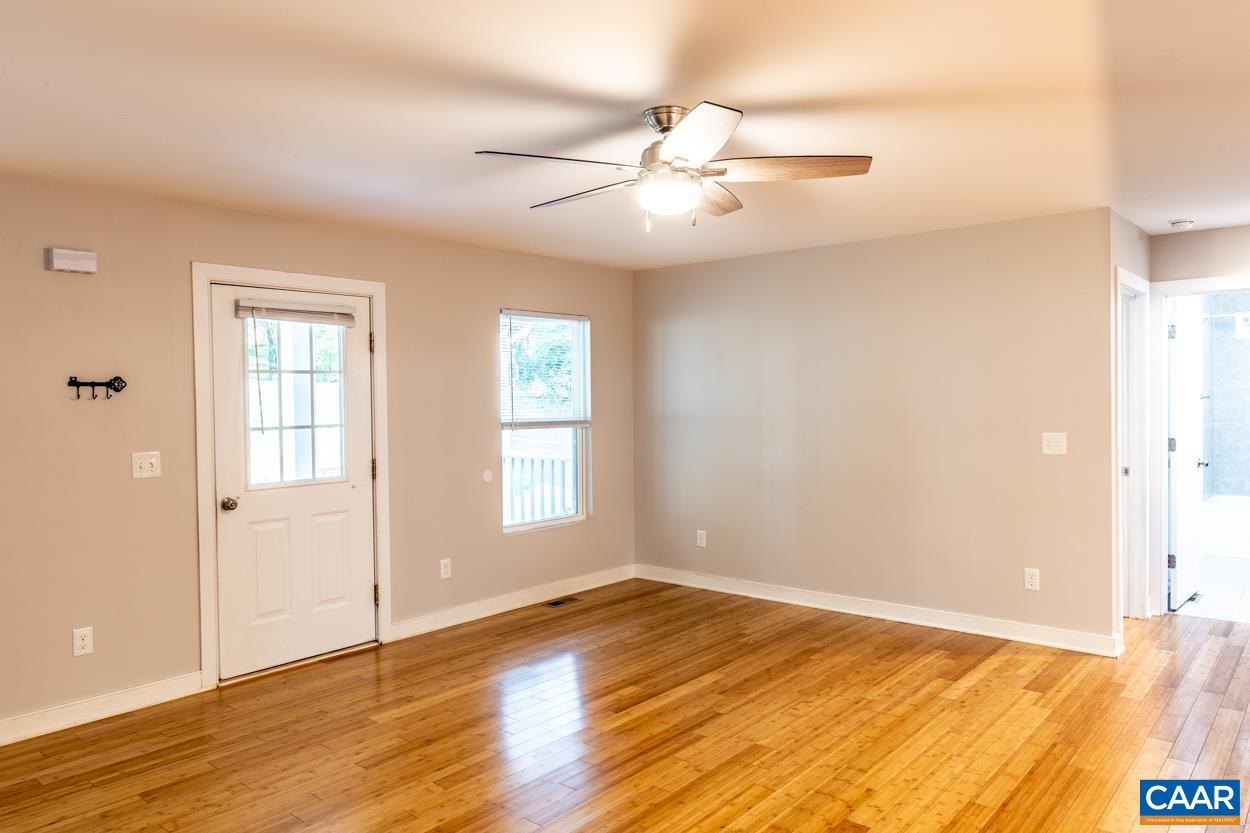 45 East Point Road Palmyra, VA 22963 - Photo 24 of 55 an empty room with wooden floor fan and windows