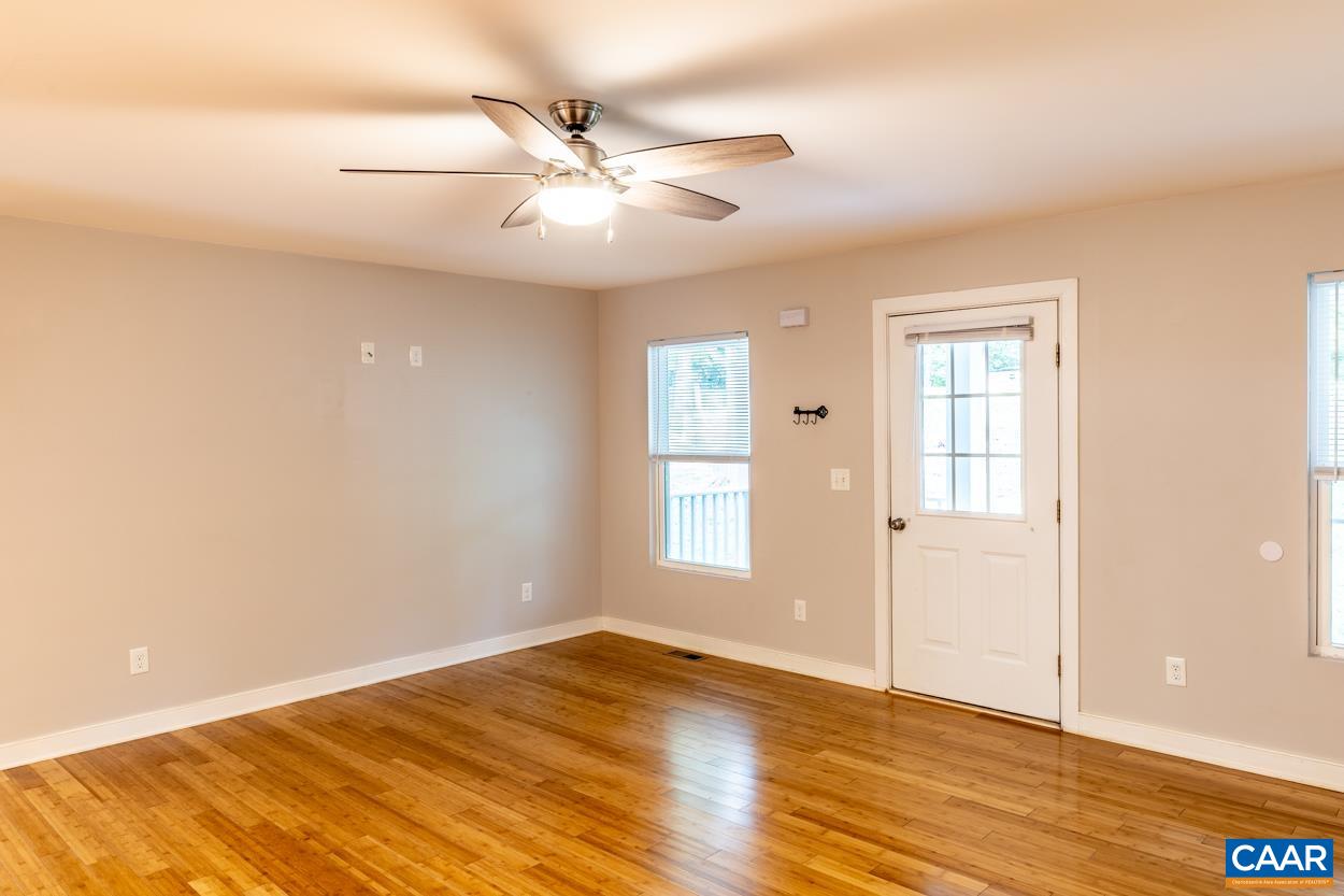 45 East Point Road Palmyra, VA 22963 - Photo 25 of 55 an empty room with wooden floor fan and windows