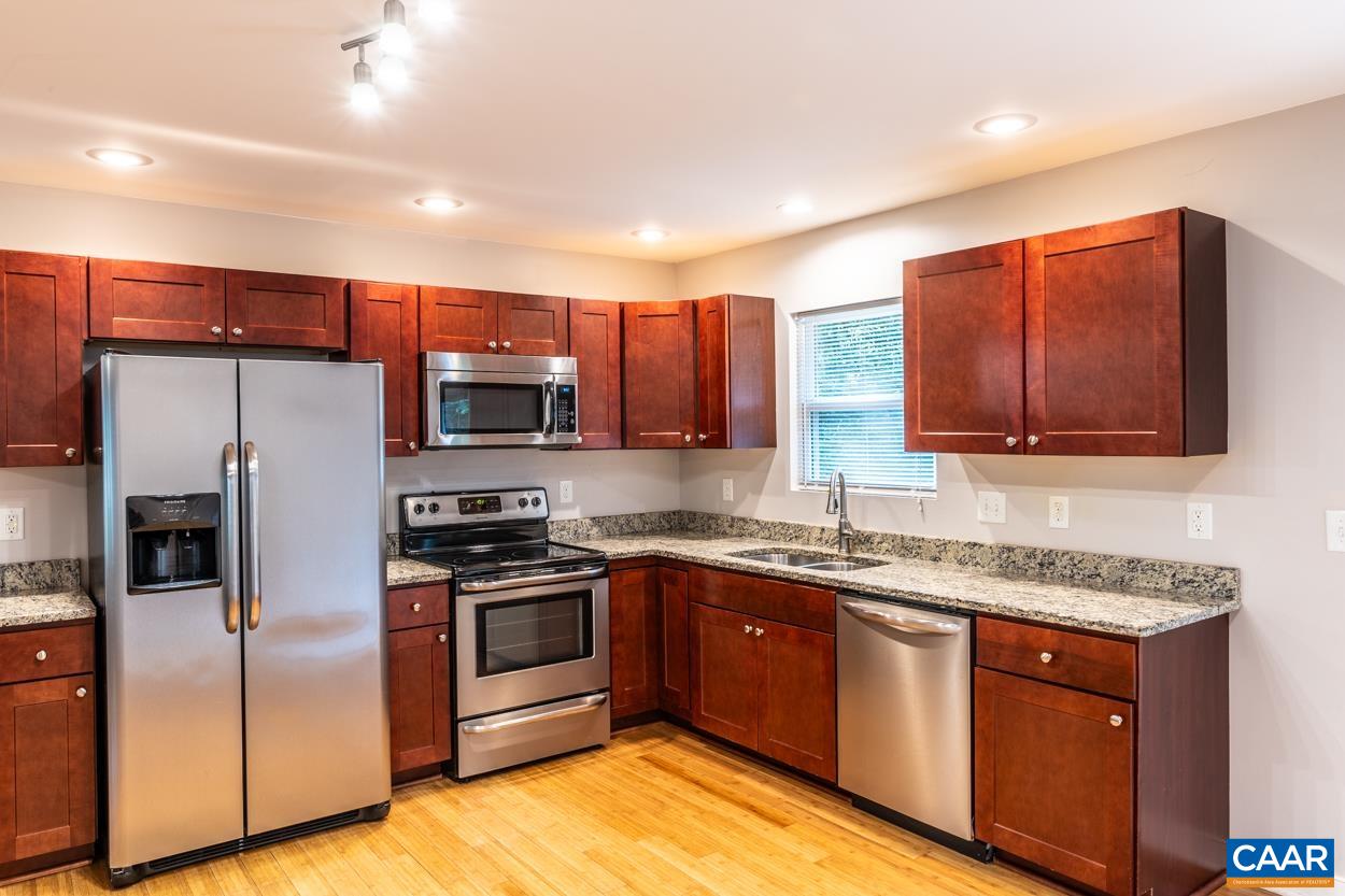 45 East Point Road Palmyra, VA 22963 - Photo 28 of 55 a kitchen with stainless steel appliances granite countertop a stove a sink dishwasher a refrigerator and a microwave oven