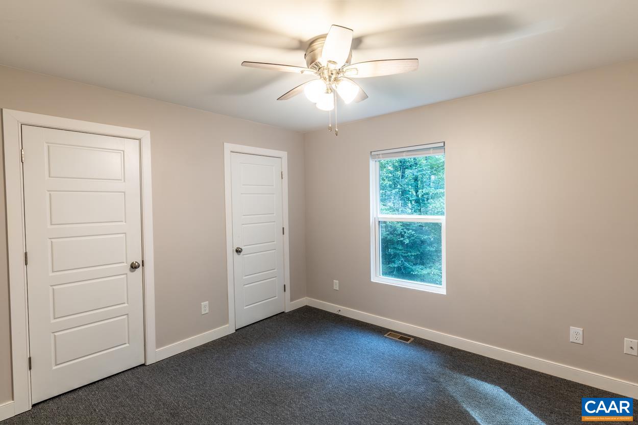 45 East Point Road Palmyra, VA 22963 - Photo 34 of 55 an empty room with windows and fan