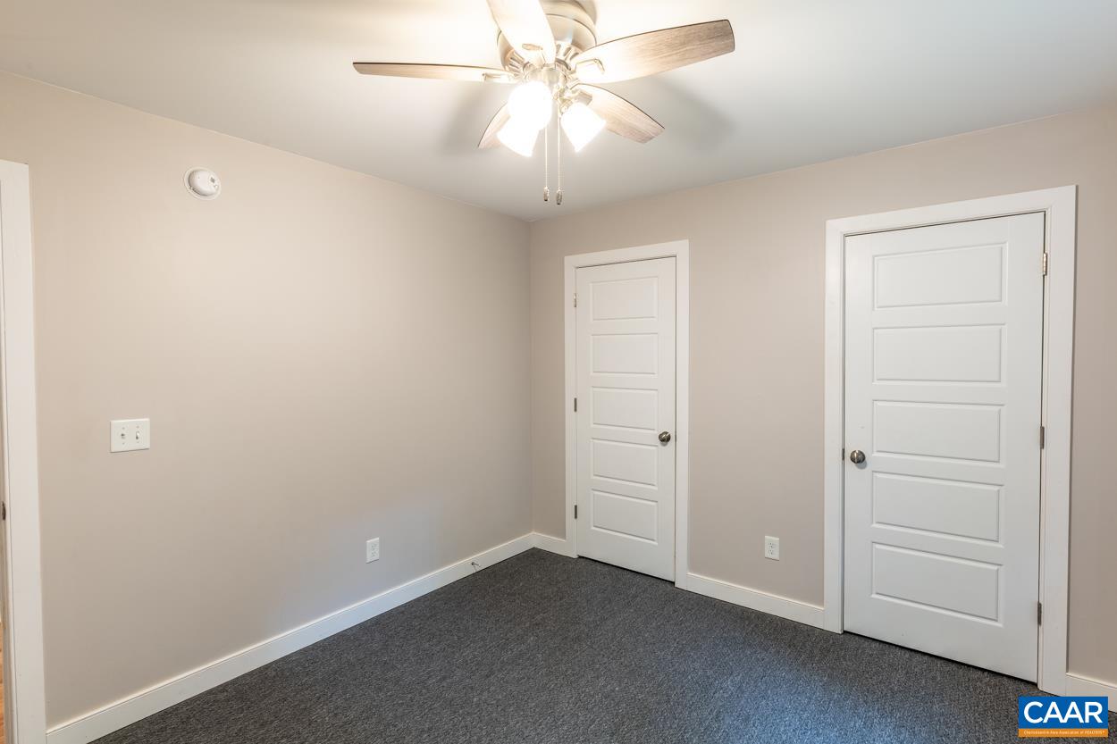 45 East Point Road Palmyra, VA 22963 - Photo 35 of 55 an empty room with closet and chandelier fan