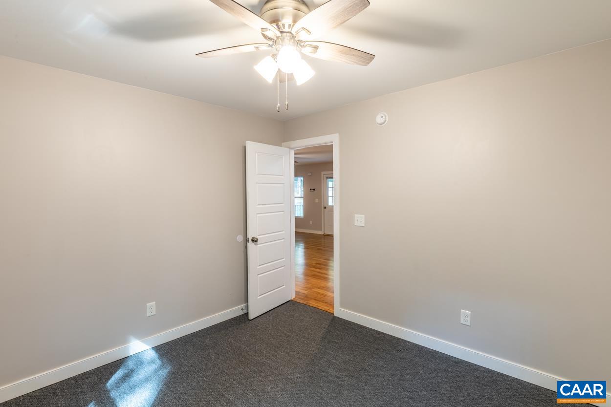 45 East Point Road Palmyra, VA 22963 - Photo 36 of 55 an empty room with a fan and a chandelier fan