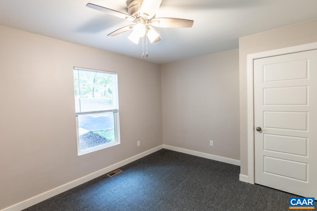 45 East Point Road Palmyra, VA 22963 - Photo 41 of 55 an empty room with a window and a fan