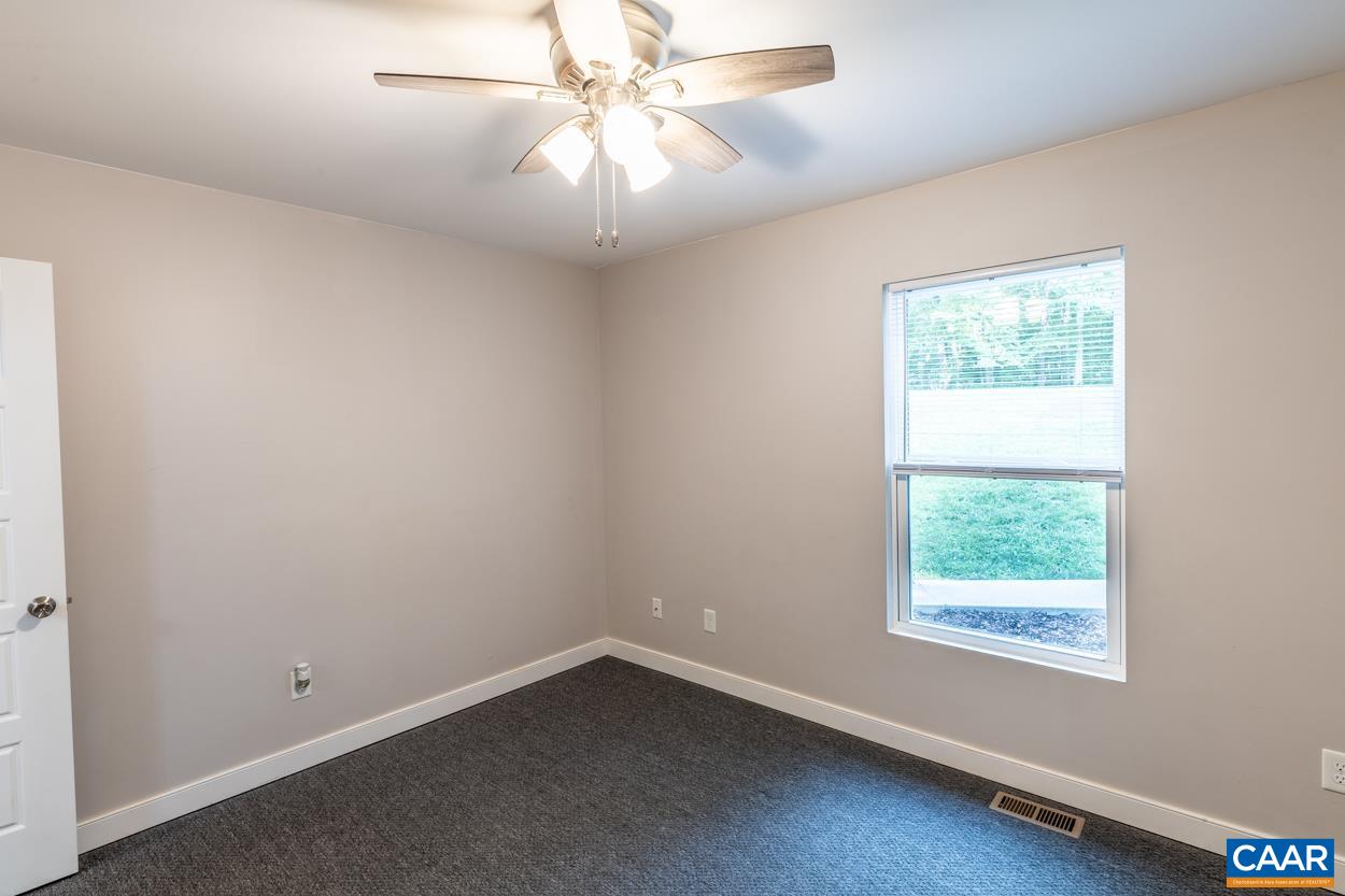 45 East Point Road Palmyra, VA 22963 - Photo 42 of 55 an empty room with a window and a fan