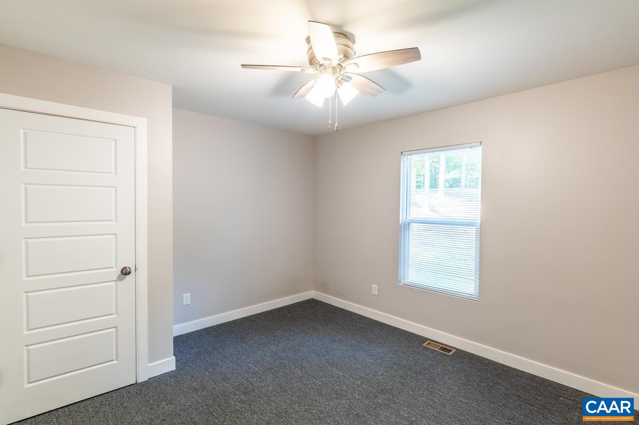 45 East Point Road Palmyra, VA 22963 - Photo 45 of 55 an empty room with a window and a ceiling fan