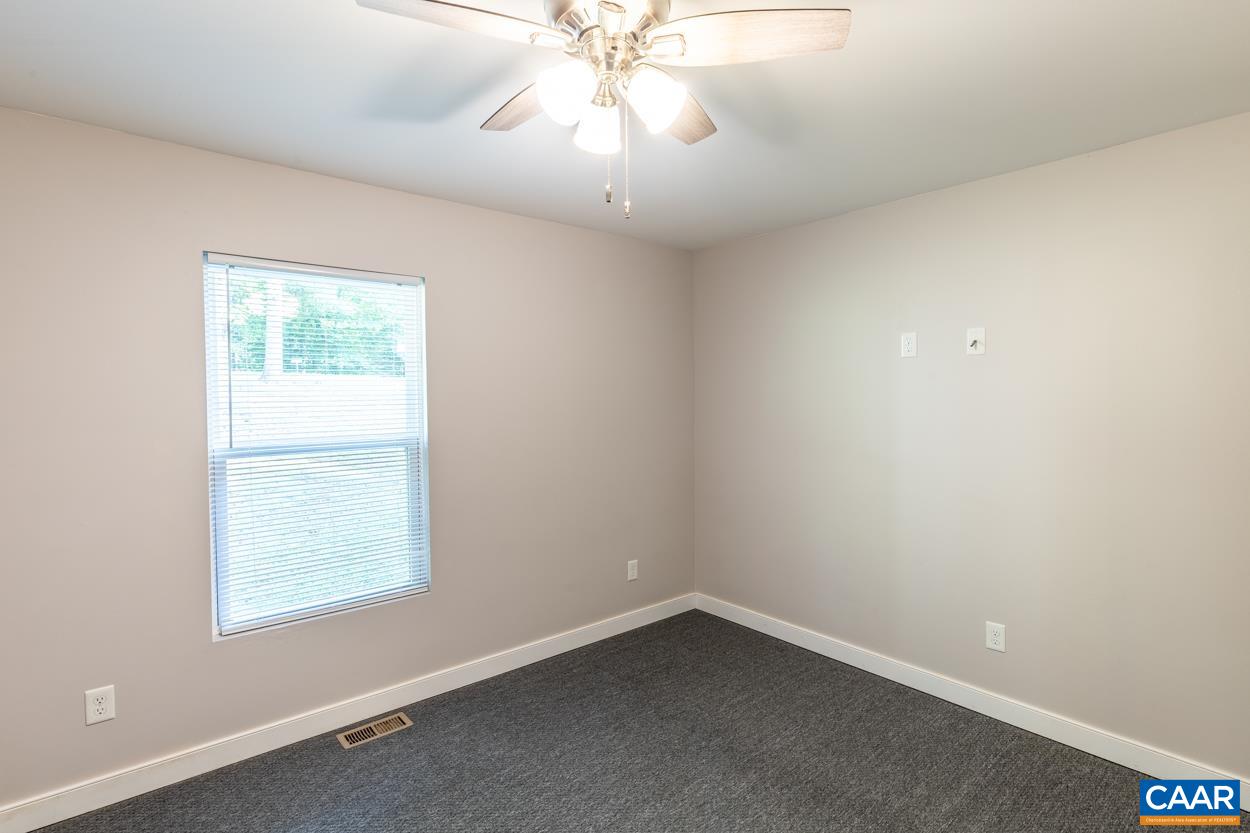 45 East Point Road Palmyra, VA 22963 - Photo 48 of 55 an empty room with a window and a fan