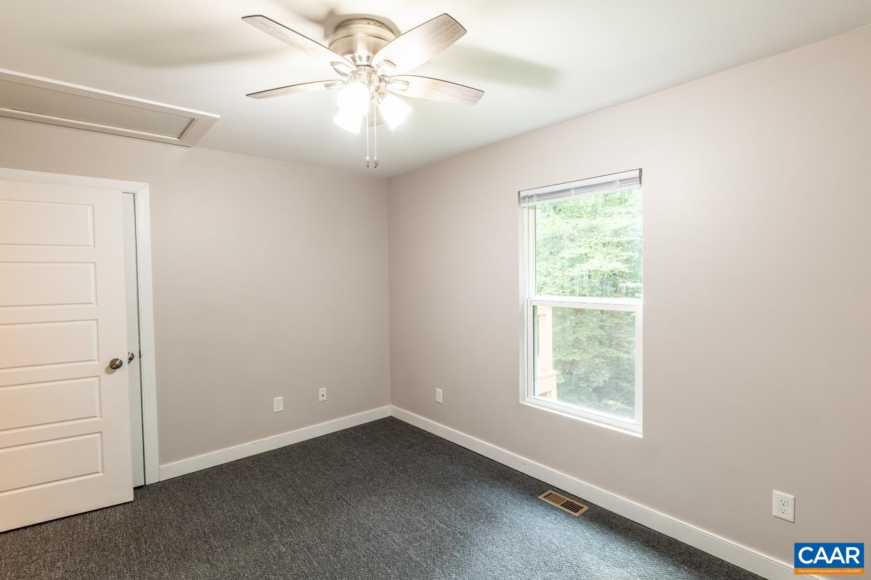 45 East Point Road Palmyra, VA 22963 - Photo 50 of 55 an empty room with a window and a fan