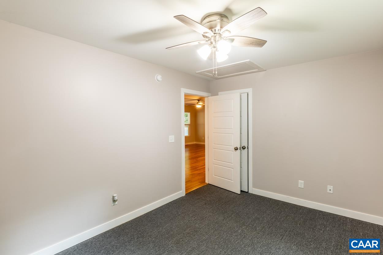 45 East Point Road Palmyra, VA 22963 - Photo 51 of 55 an empty room with a ceiling fan and a chandelier fan