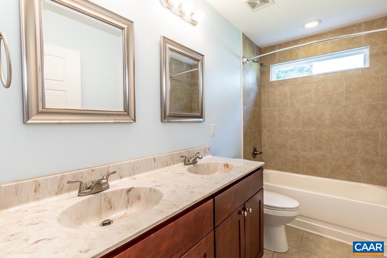 45 East Point Road Palmyra, VA 22963 - Photo 54 of 55 a bathroom with a sink a toilet and a bathtub