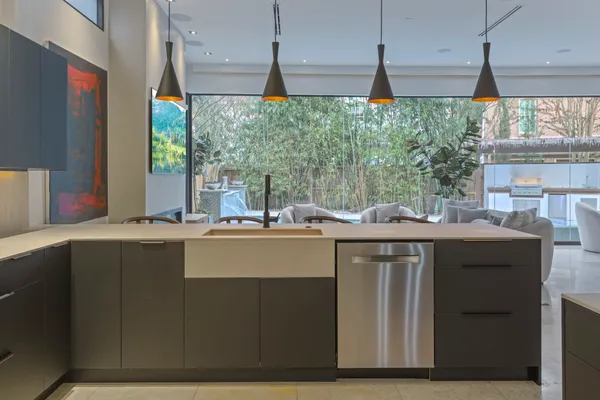 a kitchen with a sink and large window