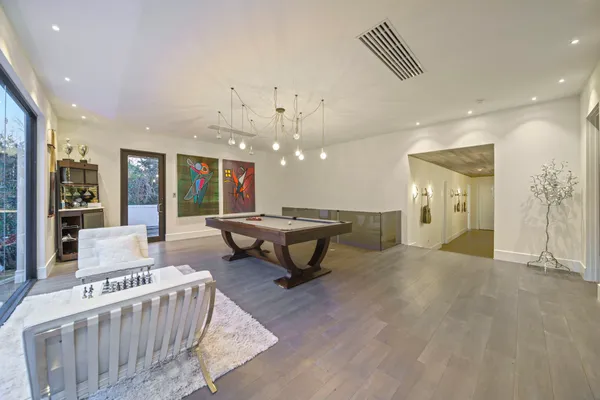 a living room with furniture and a table
