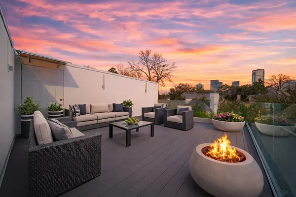 a outdoor living space with furniture and city view