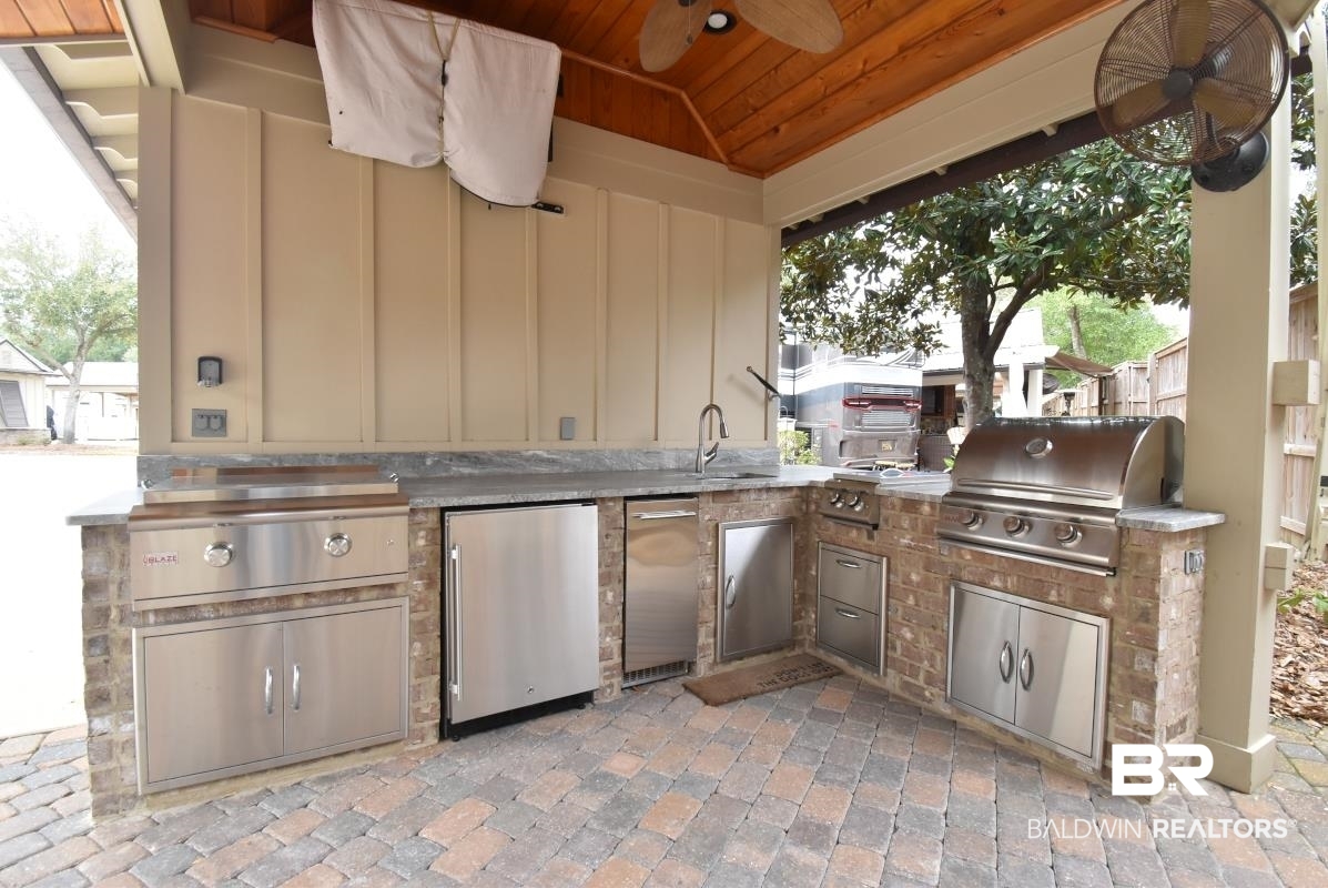 28888 Canal Road, Unit 71 Orange Beach, AL 36561 - Photo 8 of 9 View of patio featuring area for grilling, sink, and ceiling fan