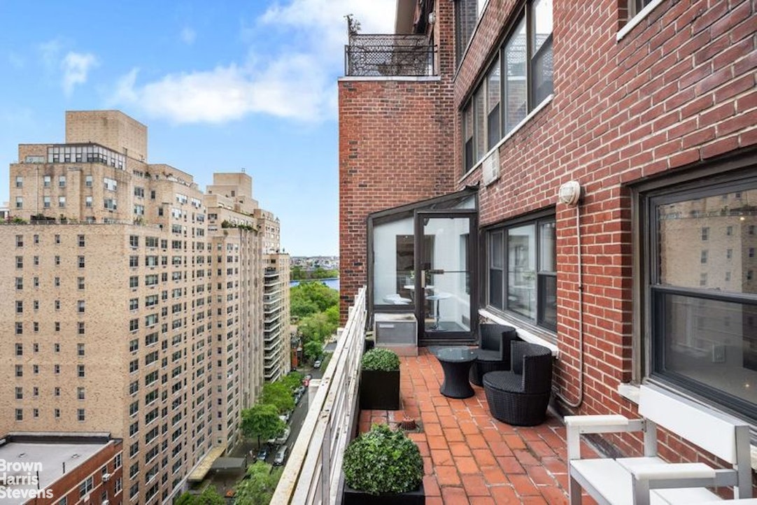 510 East 86th Street, Unit 17C Manhattan, NY 10028 - Photo 9 of 17 a view of a patio with couches chairs potted plants and wooden floor