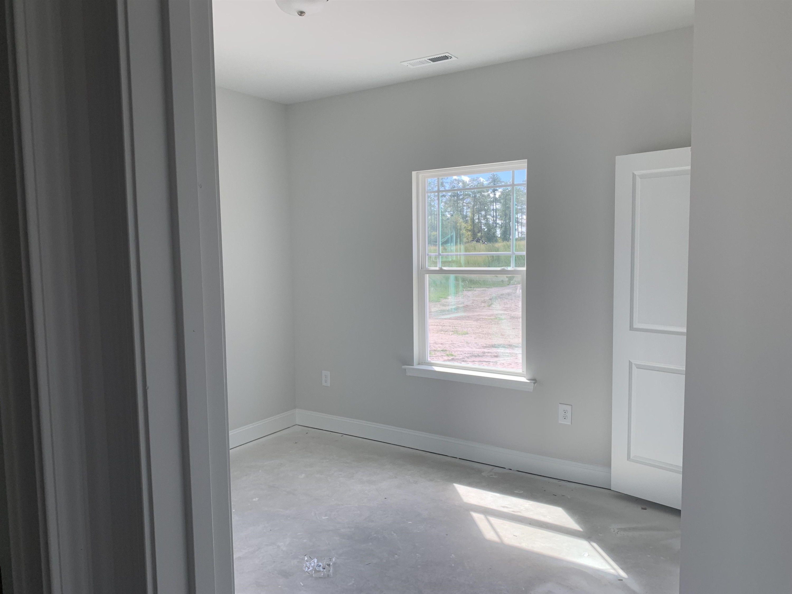 8566 Shallow Crk Trail Bailey, NC 27807 - Photo 14 of 20 a view of an empty room with a window