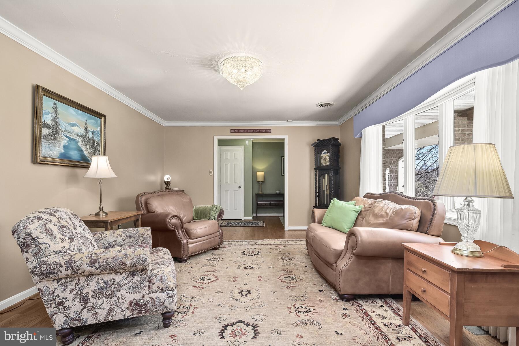 4530 Ten Oaks Road Dayton, MD 21036 - Photo 7 of 49 Living room with wood floors & crown moulding