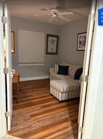 a bedroom with a bed and a flat tv screen on dresser
