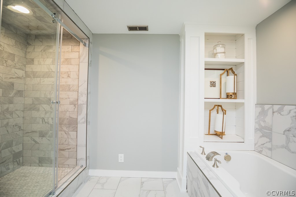 4004 Oakleaf Road Richmond, VA 23235 - Photo 29 of 47 a bathroom with a bathtub and a shower