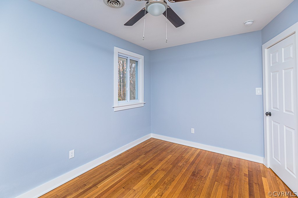 4004 Oakleaf Road Richmond, VA 23235 - Photo 32 of 47 a view of empty room with wooden floor and fan