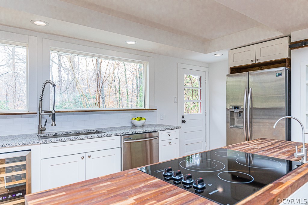 4004 Oakleaf Road Richmond, VA 23235 - Photo 6 of 47 a kitchen with a sink stove and cabinets