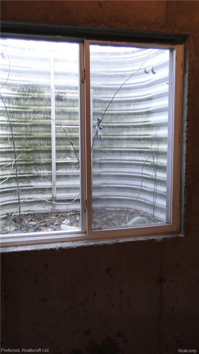 41496 Glade Road, Unit 58 Canton, MI 48187 - Photo 36 of 39 EGRESS WINDOW. UNFINISHED BSMT
