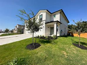 213 Saide Street Georgetown, TX 78626 - Photo 2 of 32 Contemporary two-story residence featuring a white facade and dark trim accents