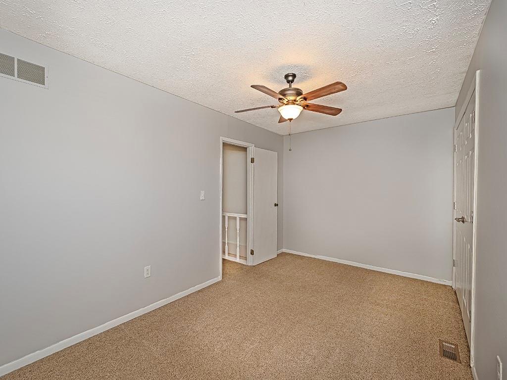 120 Forest Drive Seven Fields, PA 16046 - Photo 16 of 24 an empty room with a window and a fan
