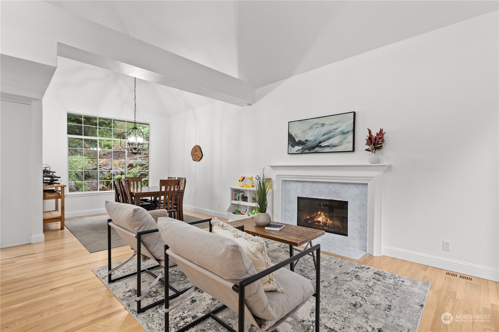 10411 Northeast 152nd Place Bothell, WA 98011 - Photo 14 of 38 a living room with furniture and a fireplace