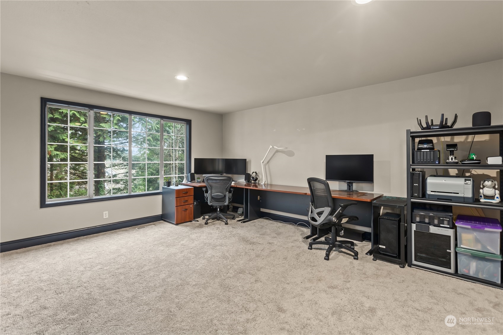 10411 Northeast 152nd Place Bothell, WA 98011 - Photo 19 of 38 a view of a workspace with furniture and a window