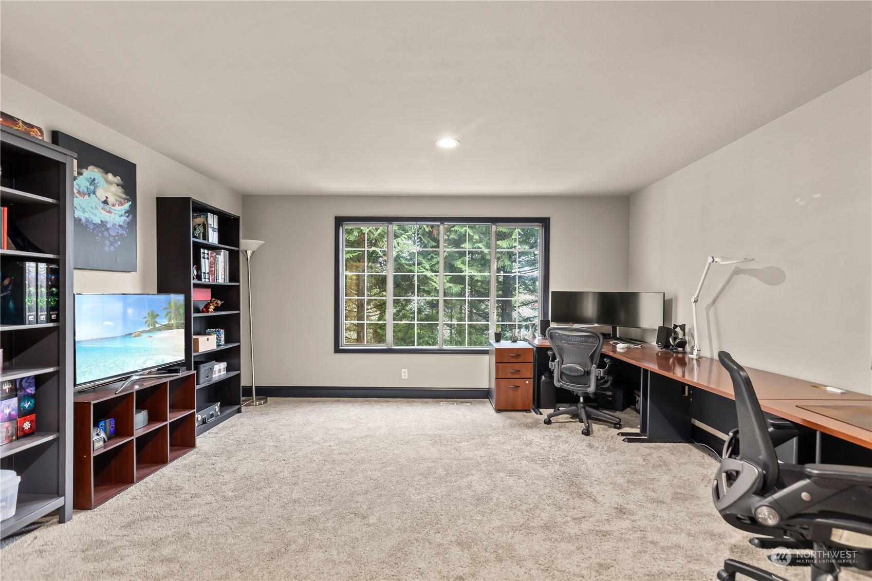 10411 Northeast 152nd Place Bothell, WA 98011 - Photo 20 of 38 a view of a workspace with furniture and a window