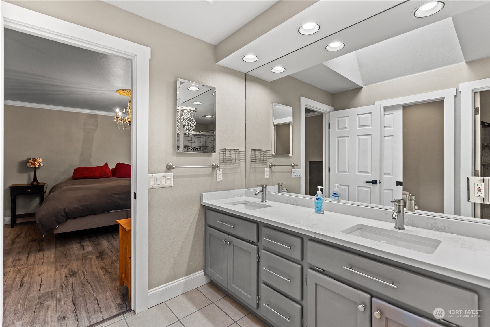10411 Northeast 152nd Place Bothell, WA 98011 - Photo 25 of 38 a en suite bathroom with double vanity and a mirror