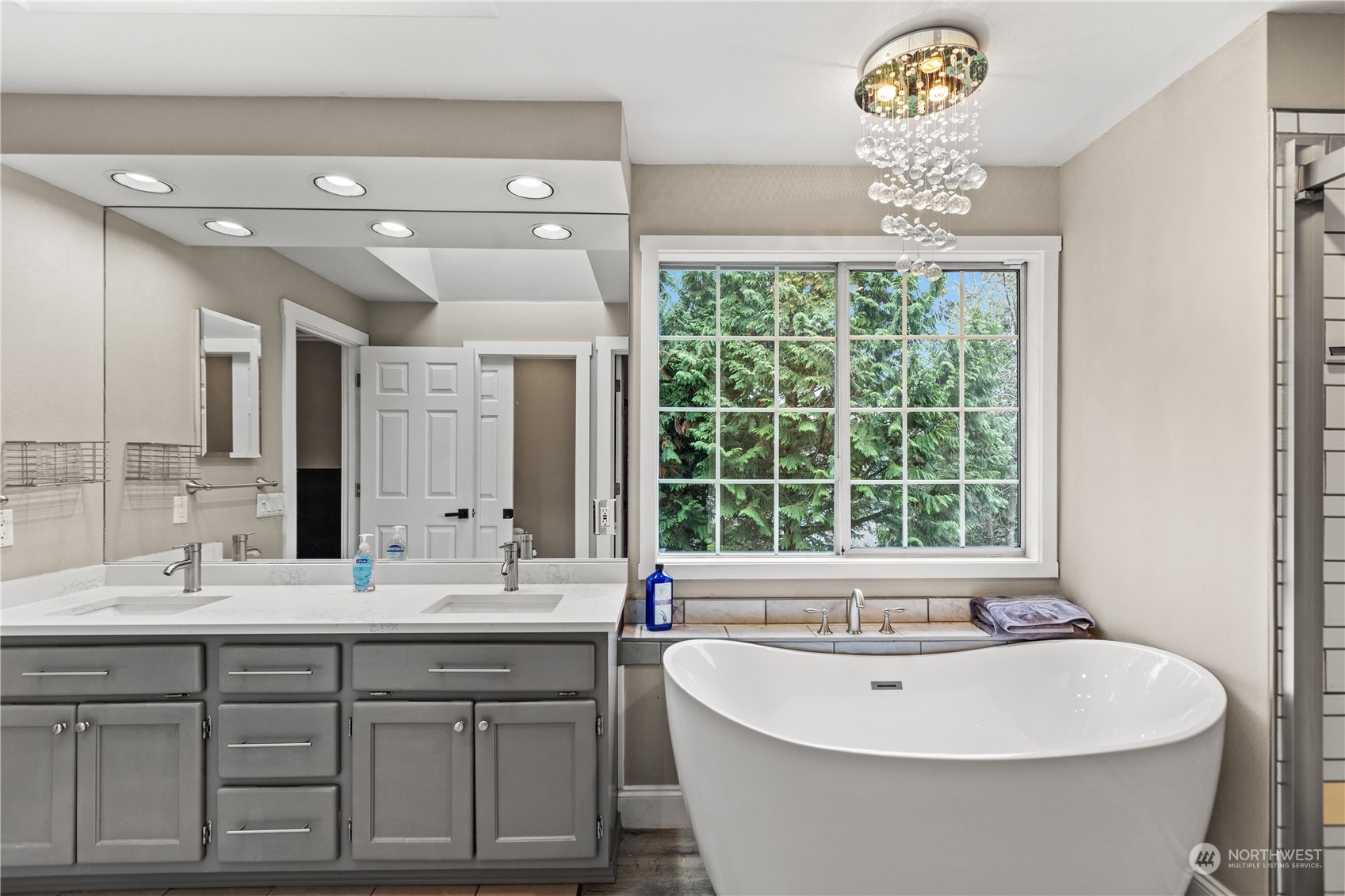 10411 Northeast 152nd Place Bothell, WA 98011 - Photo 27 of 38 a bathroom with a large tub sink and window