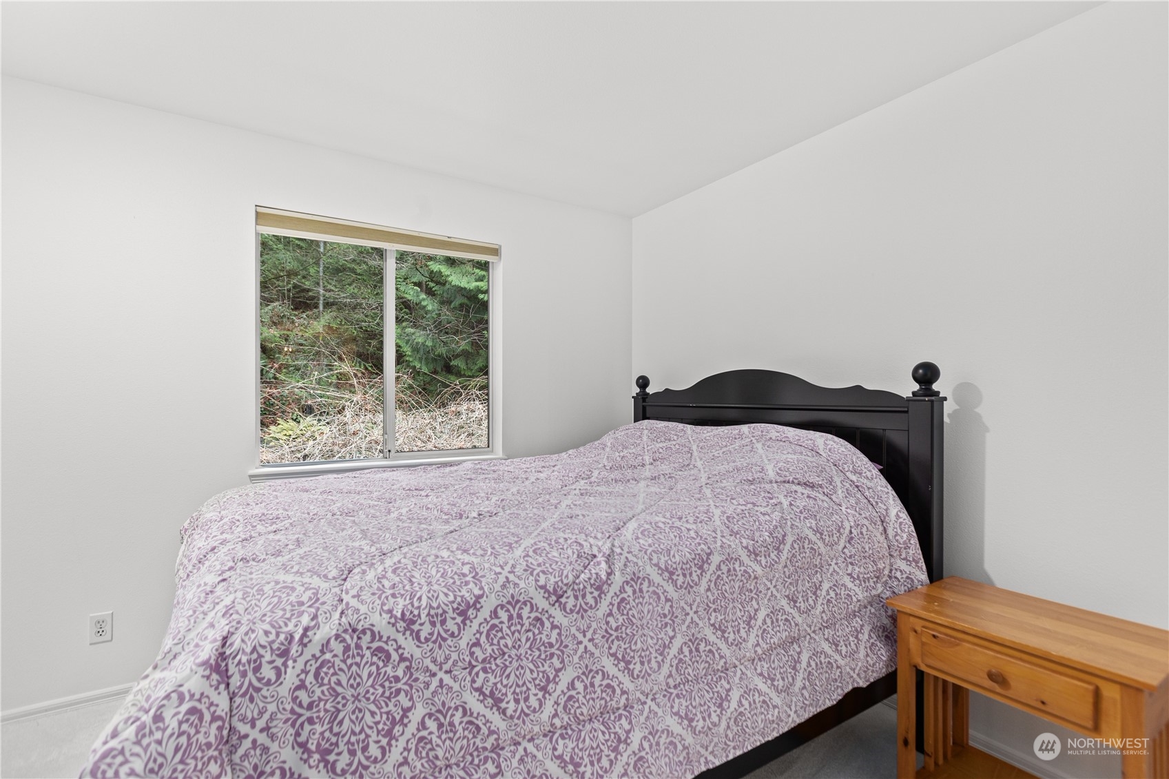 10411 Northeast 152nd Place Bothell, WA 98011 - Photo 30 of 38 a bedroom with a bed and window