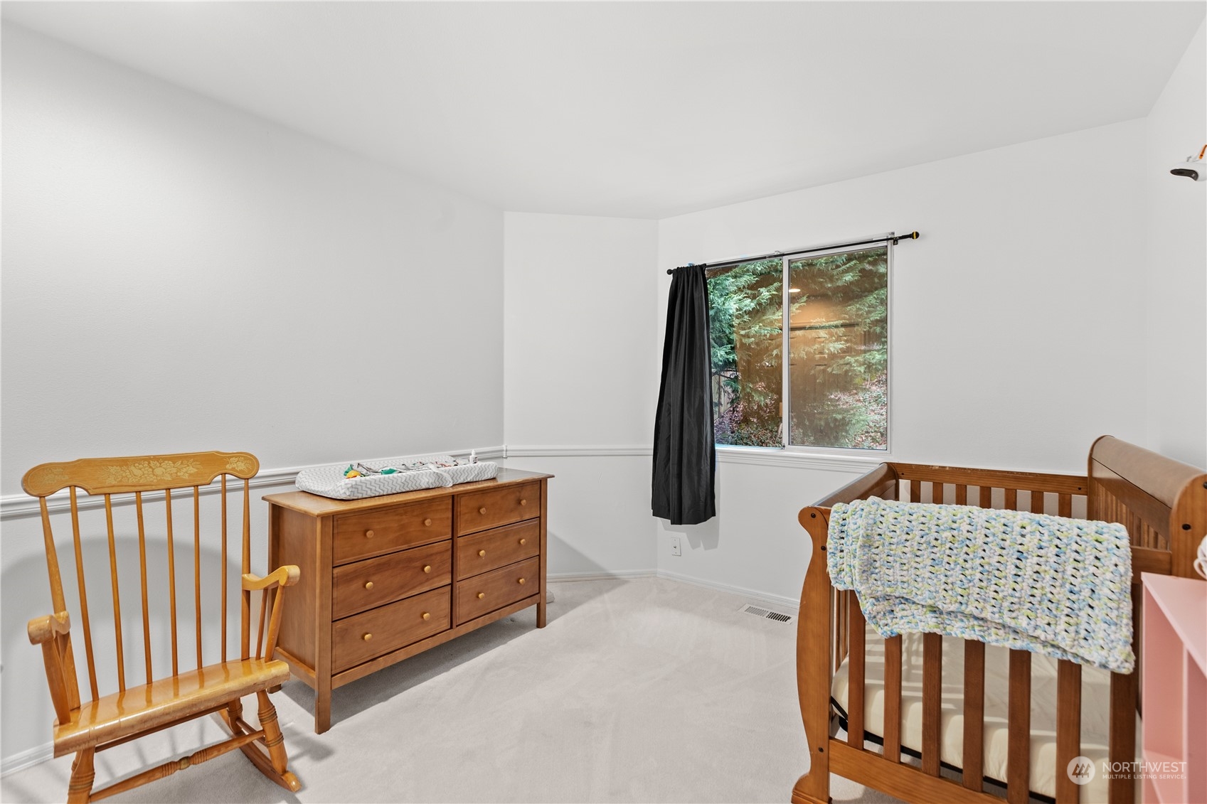 10411 Northeast 152nd Place Bothell, WA 98011 - Photo 31 of 38 a bedroom with furniture and a window