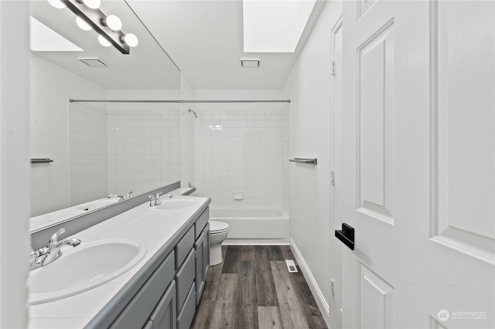 10411 Northeast 152nd Place Bothell, WA 98011 - Photo 32 of 38 a bathroom with a sink a toilet and shower