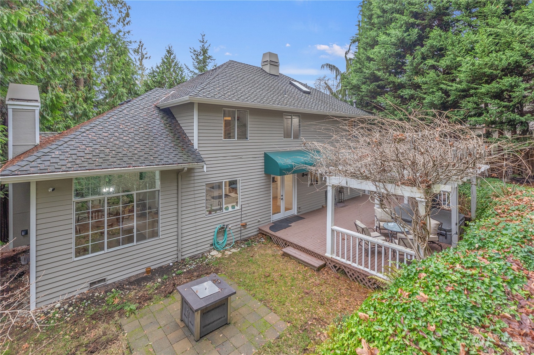 10411 Northeast 152nd Place Bothell, WA 98011 - Photo 34 of 38 a view of a house with backyard and sitting area