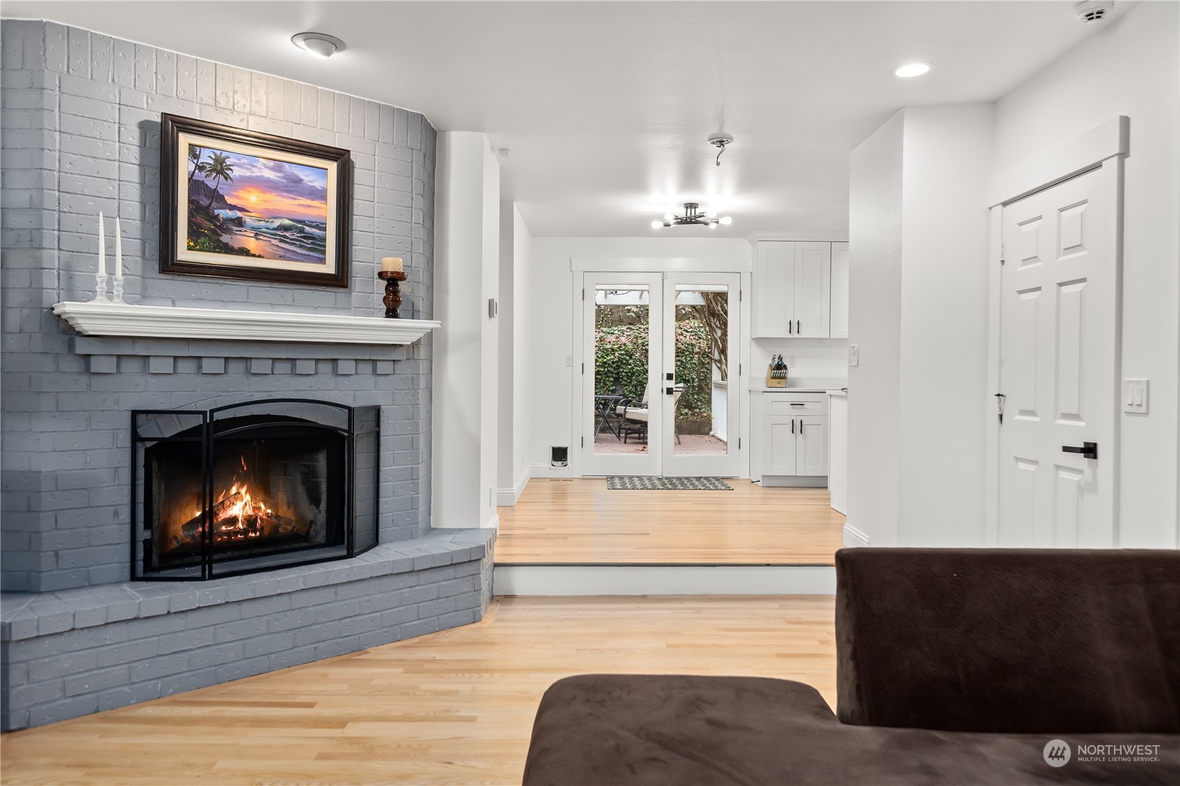 10411 Northeast 152nd Place Bothell, WA 98011 - Photo 8 of 38 a living room with furniture and a fireplace