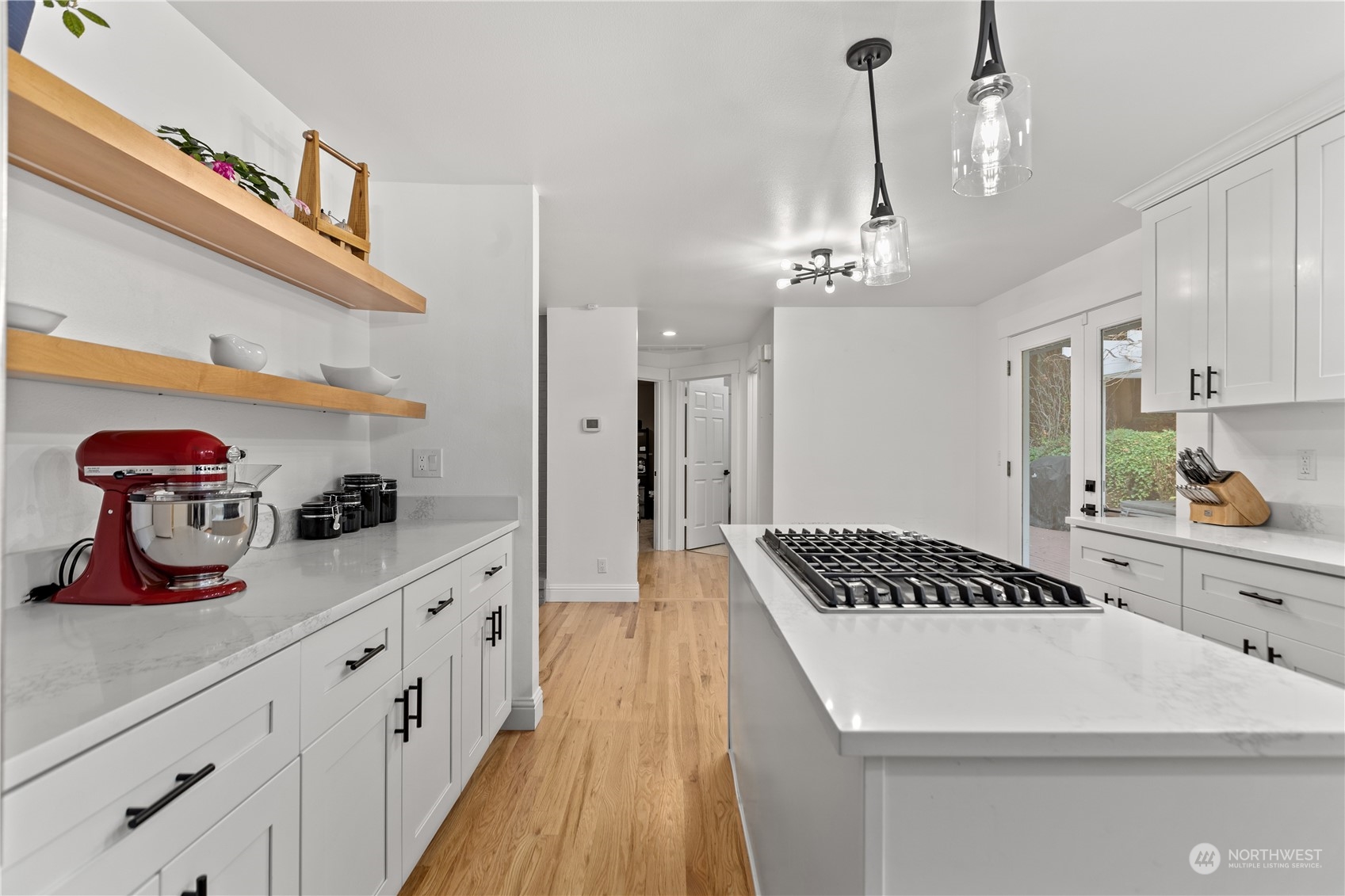 10411 Northeast 152nd Place Bothell, WA 98011 - Photo 10 of 38 a kitchen with granite countertop a stove and cabinets