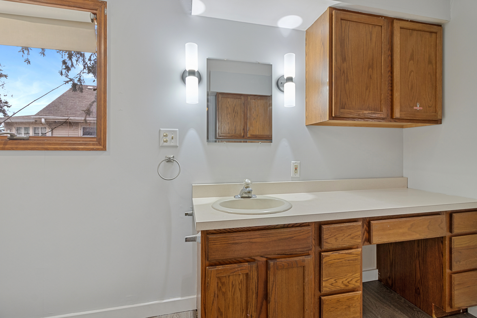 139 Elm Street DeKalb, IL 60115 - Photo 9 of 20 a bathroom with a sink and a mirror