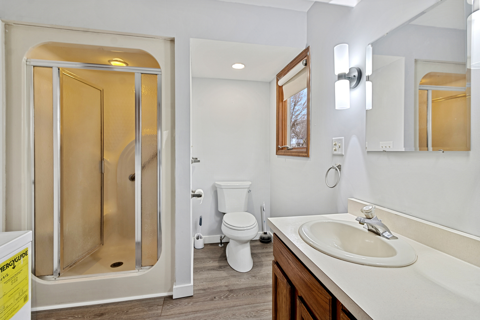 139 Elm Street DeKalb, IL 60115 - Photo 10 of 20 a bathroom with a granite countertop sink toilet and shower